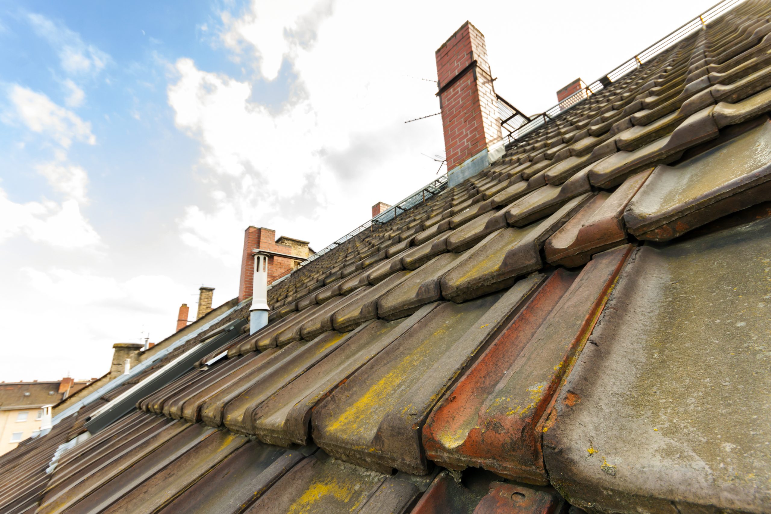 Old roof tiles in need of repair
